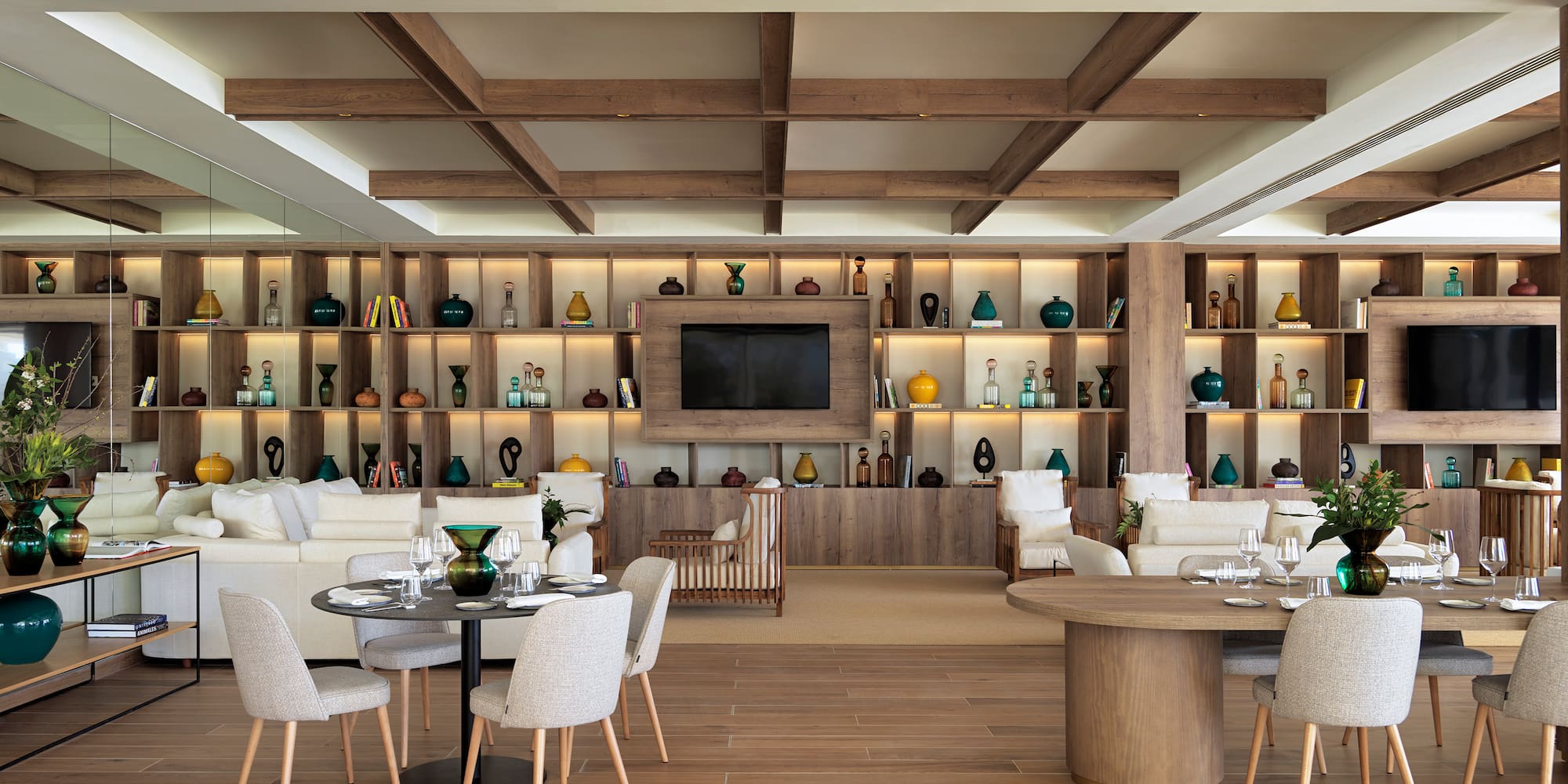 a room with a tv and tables