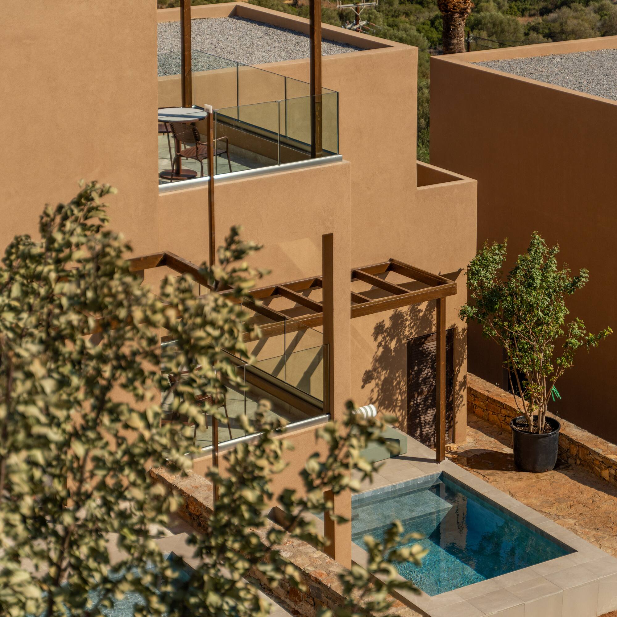 a building with a pool and a tree