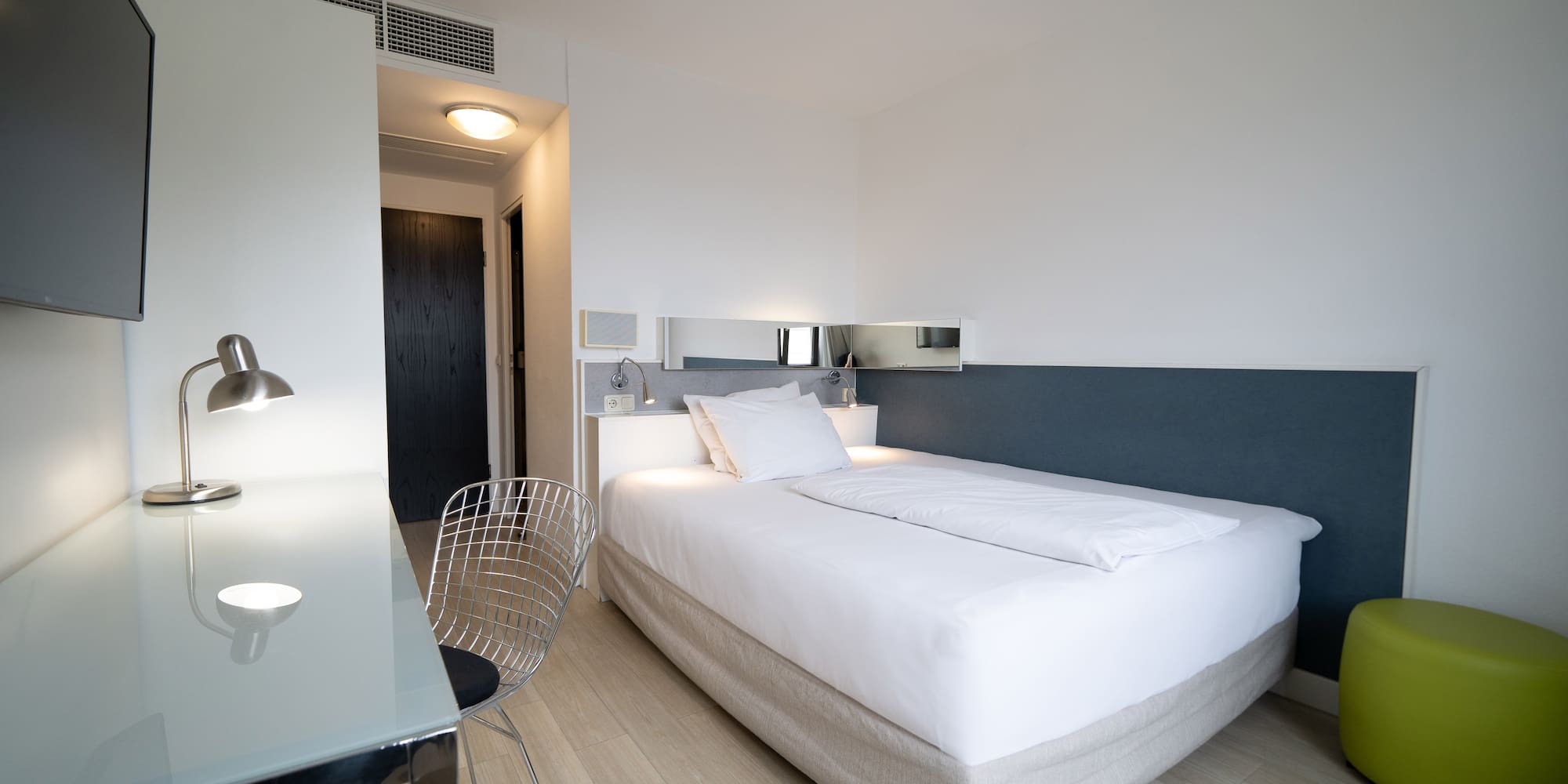 a bed with a desk and chair