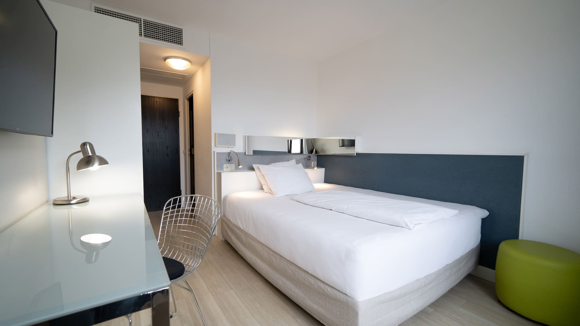 a bed with a desk and chair