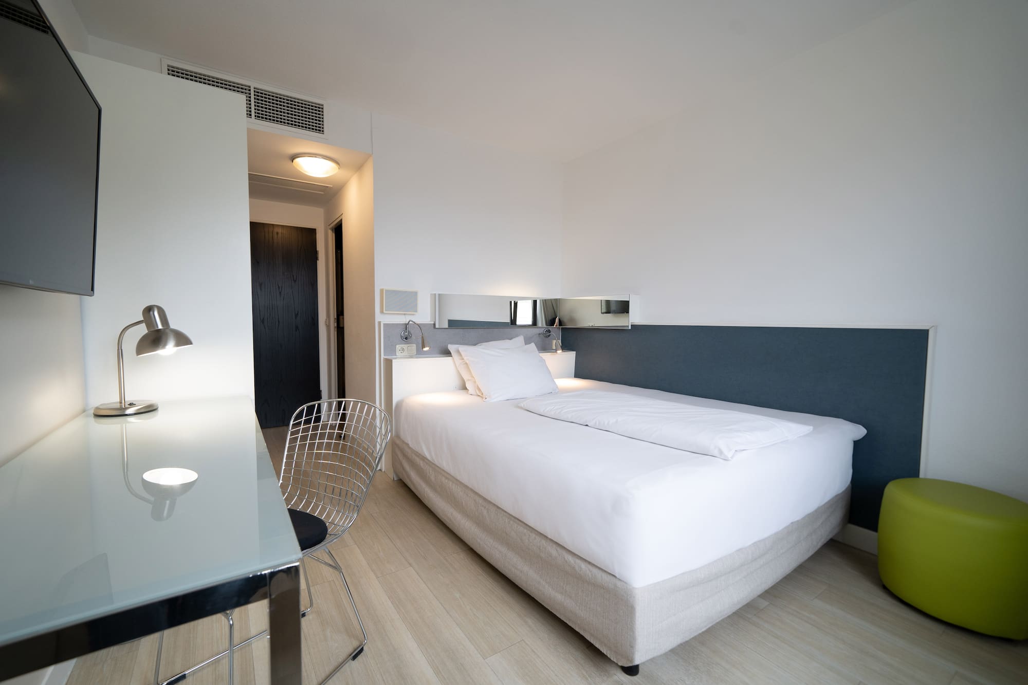 a bed with a desk and chair