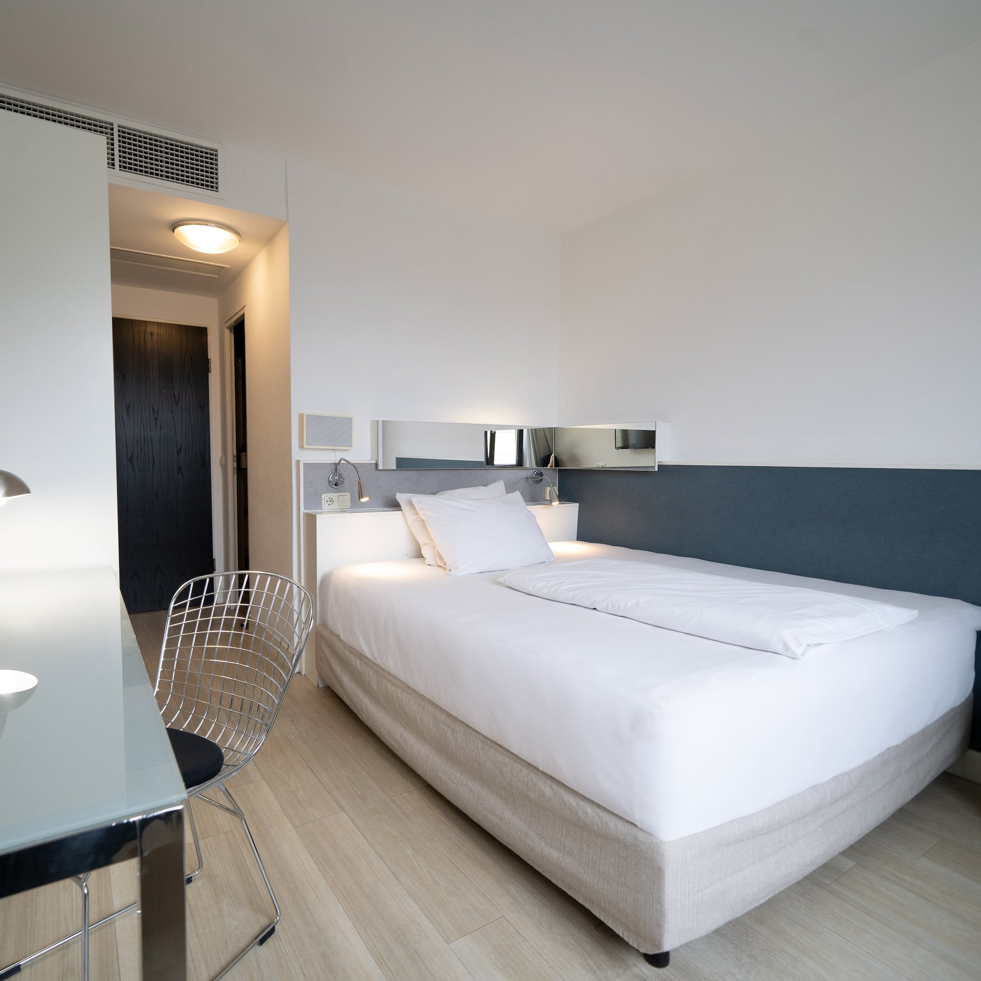 a bed with a desk and chair