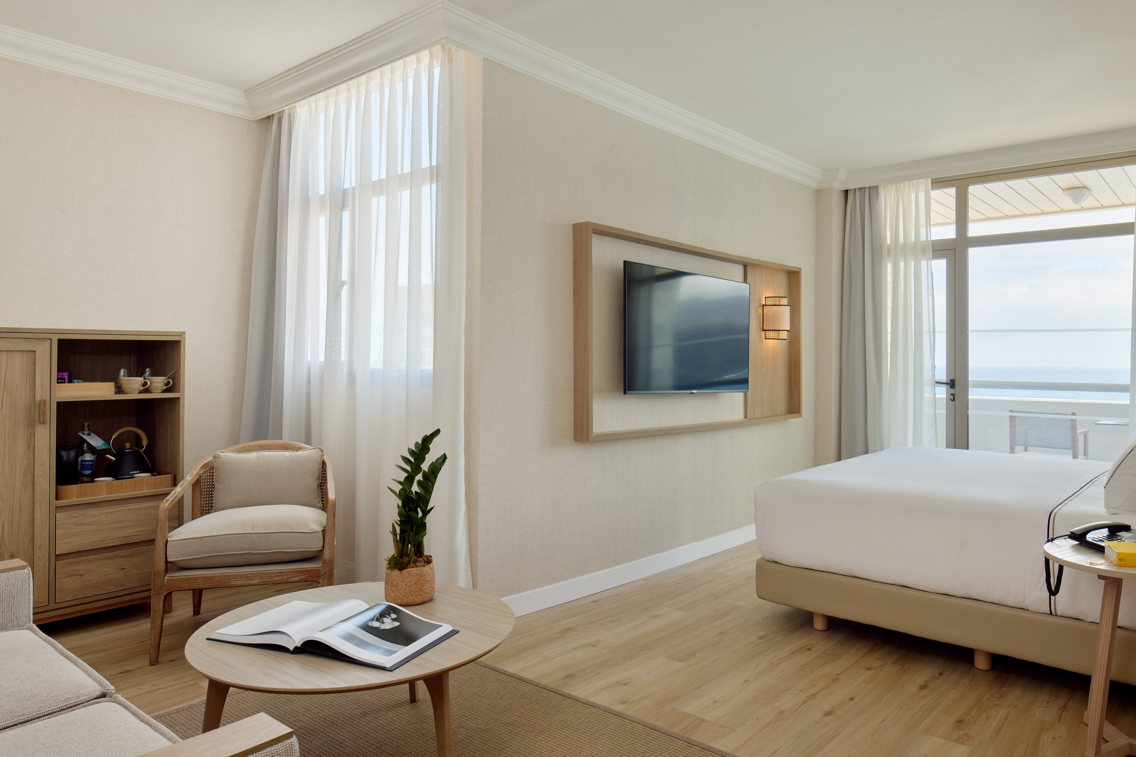 a room with a bed and a television on the wall