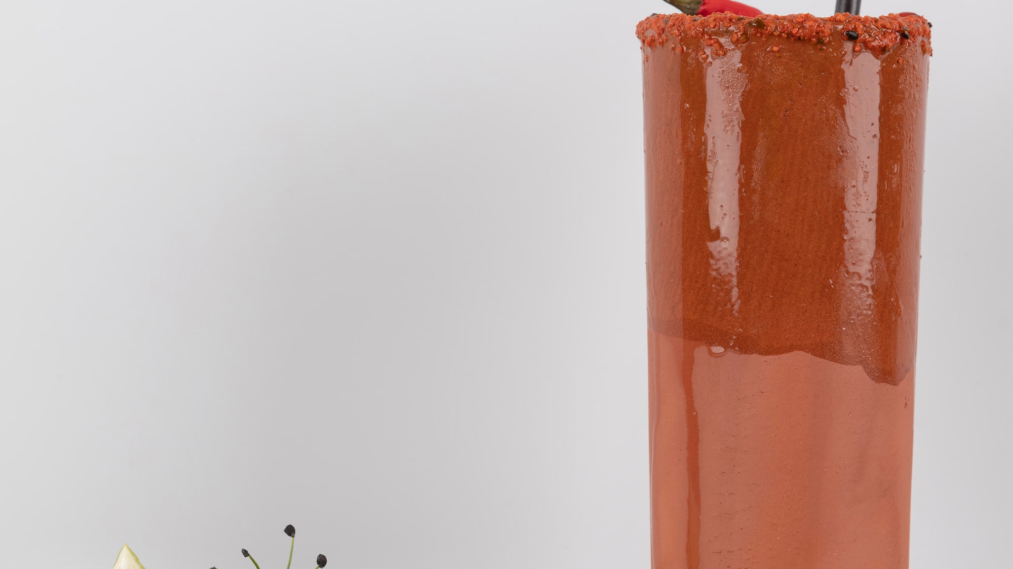 a glass with a drink and a plate of food