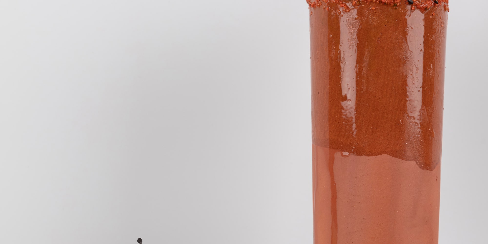 a glass with a drink and a plate of food