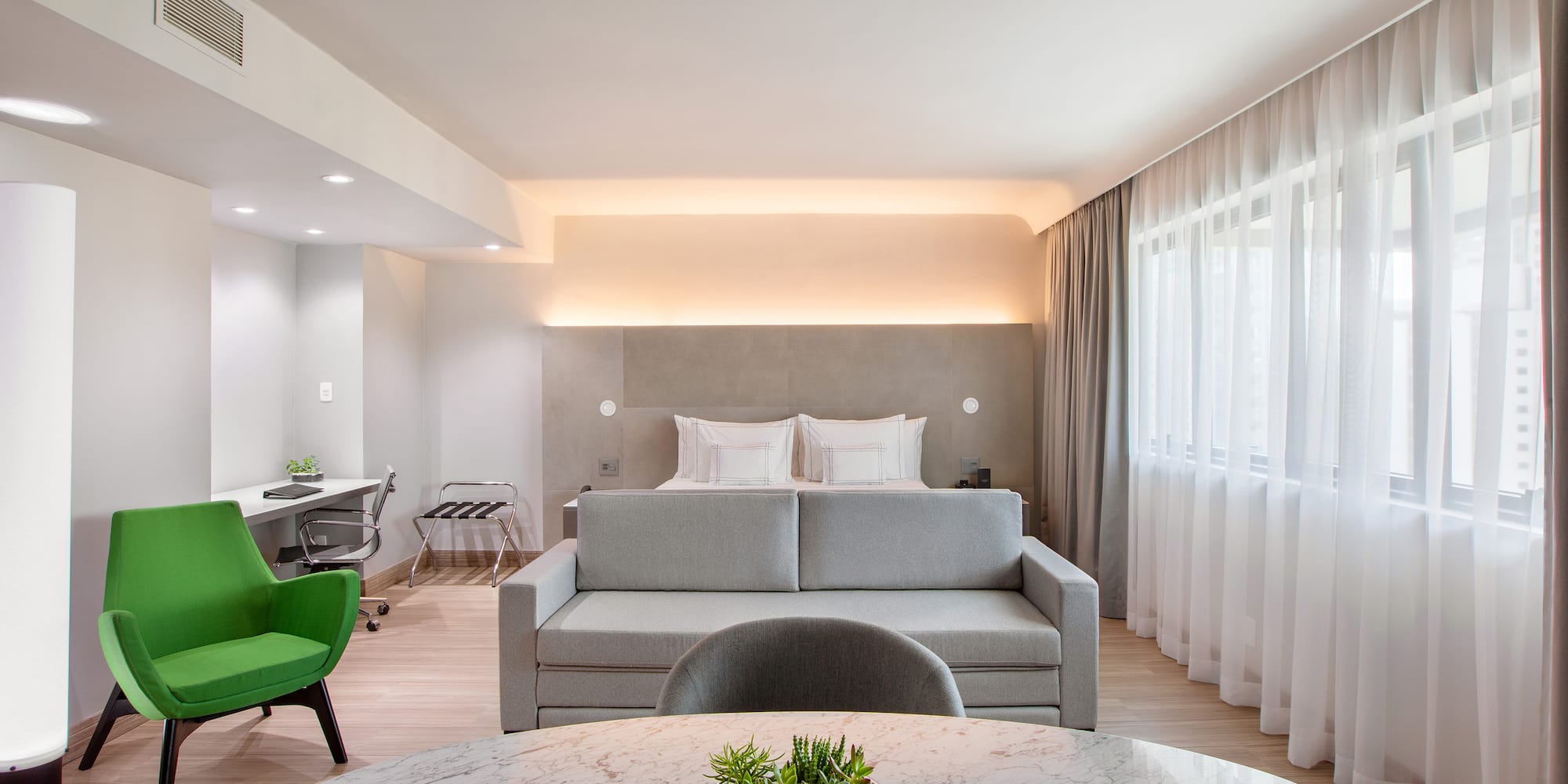 a room with a bed and a sofa