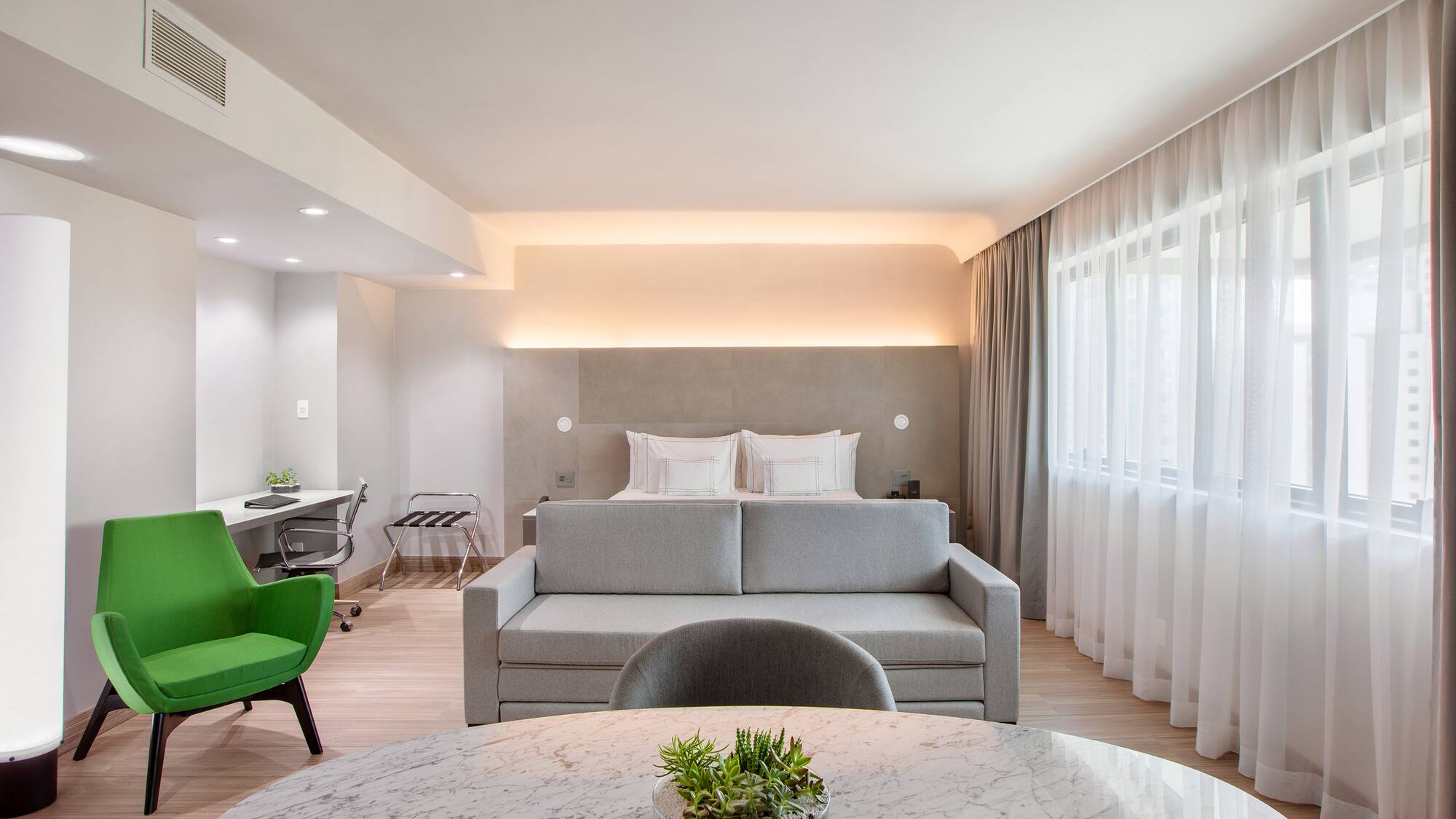 a room with a bed and a sofa