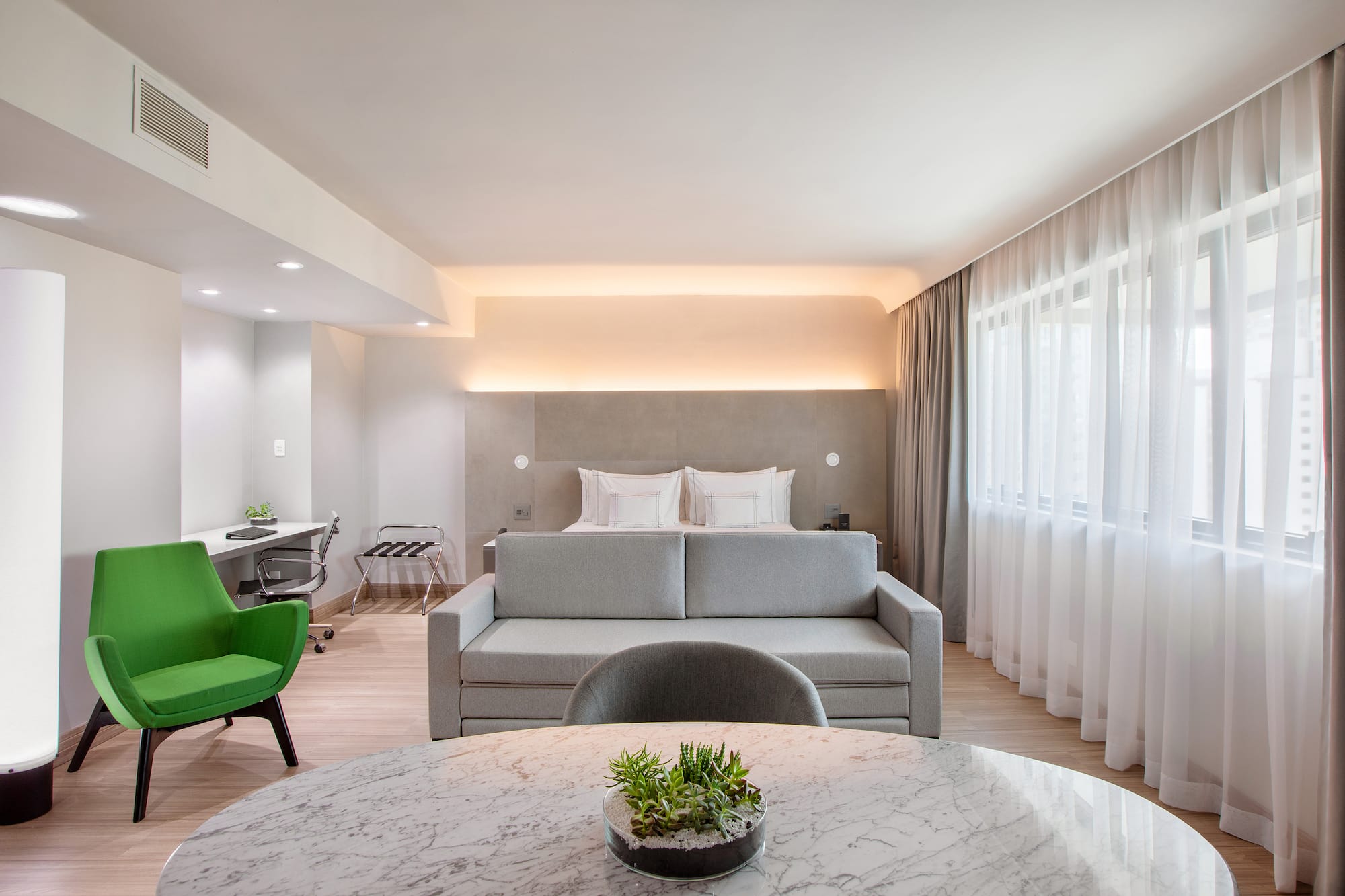 a room with a bed and a sofa