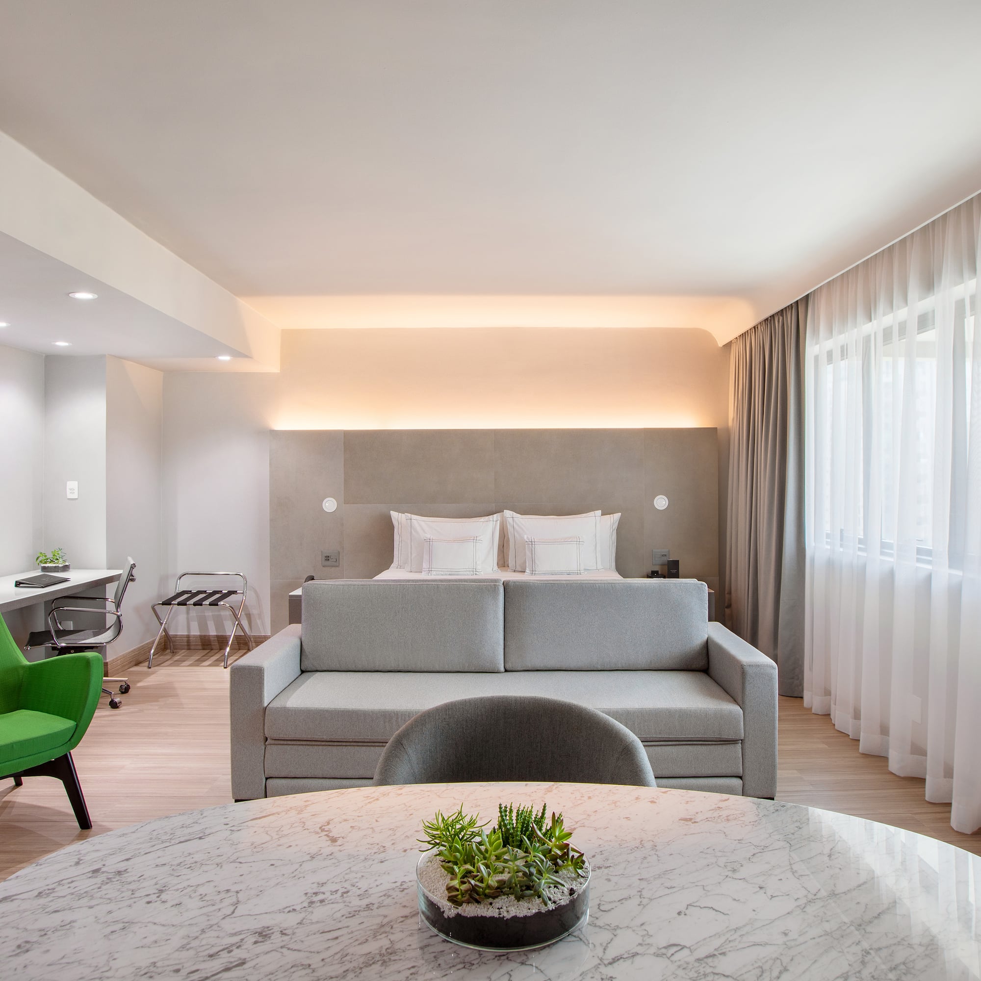 a room with a bed and a sofa