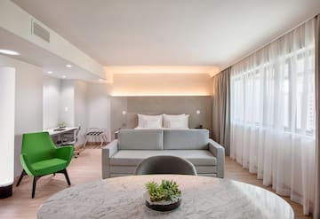 a room with a bed and a sofa