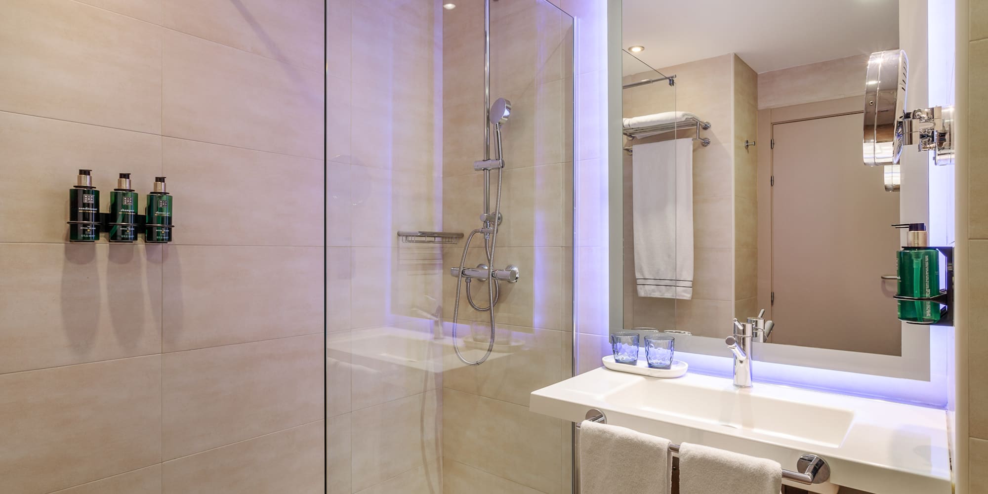 a bathroom with a shower and sink