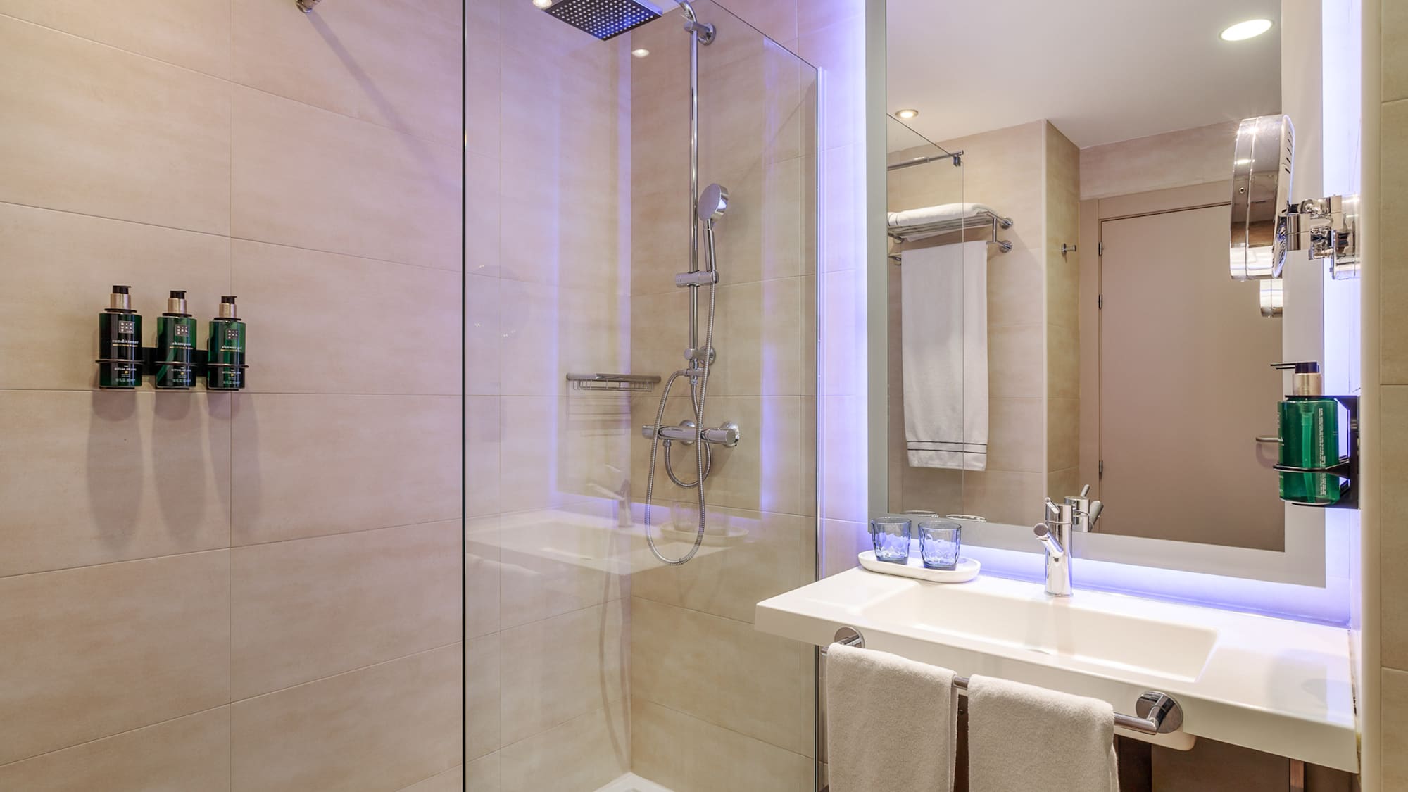 a bathroom with a shower and sink