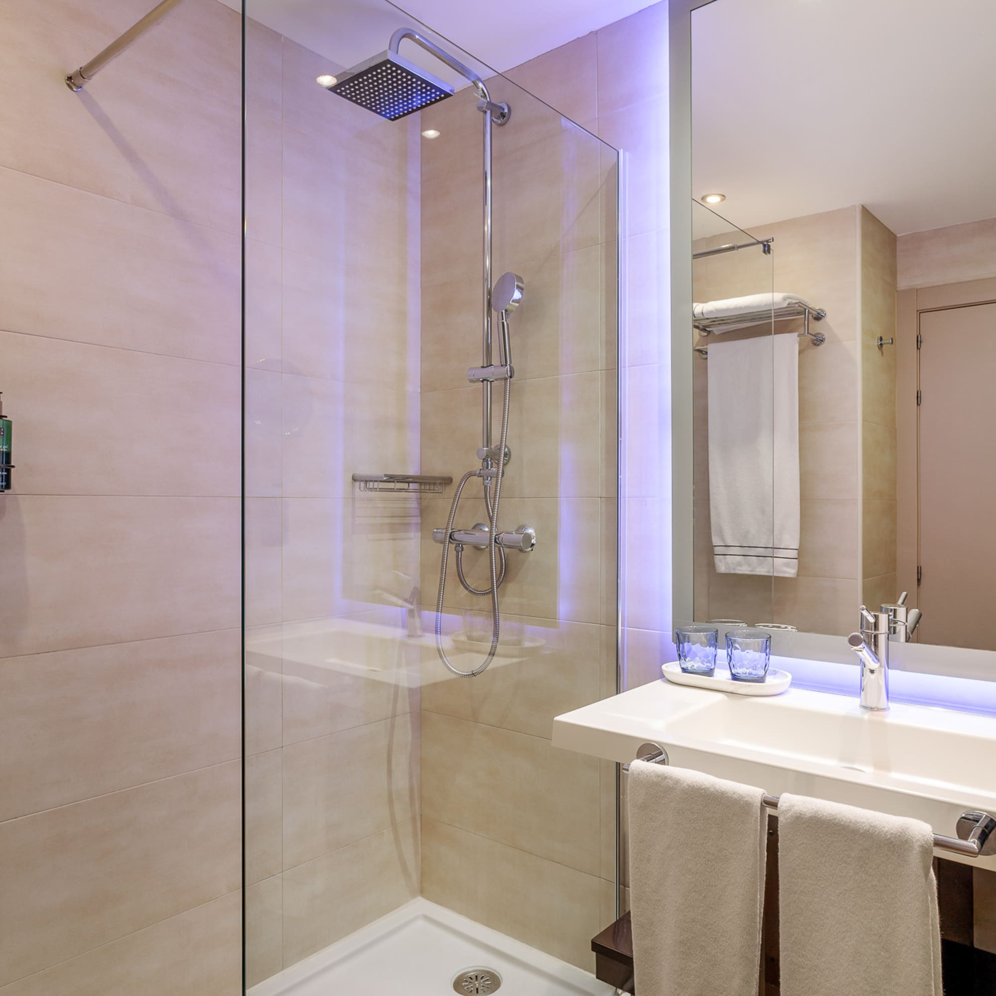 a bathroom with a shower and sink