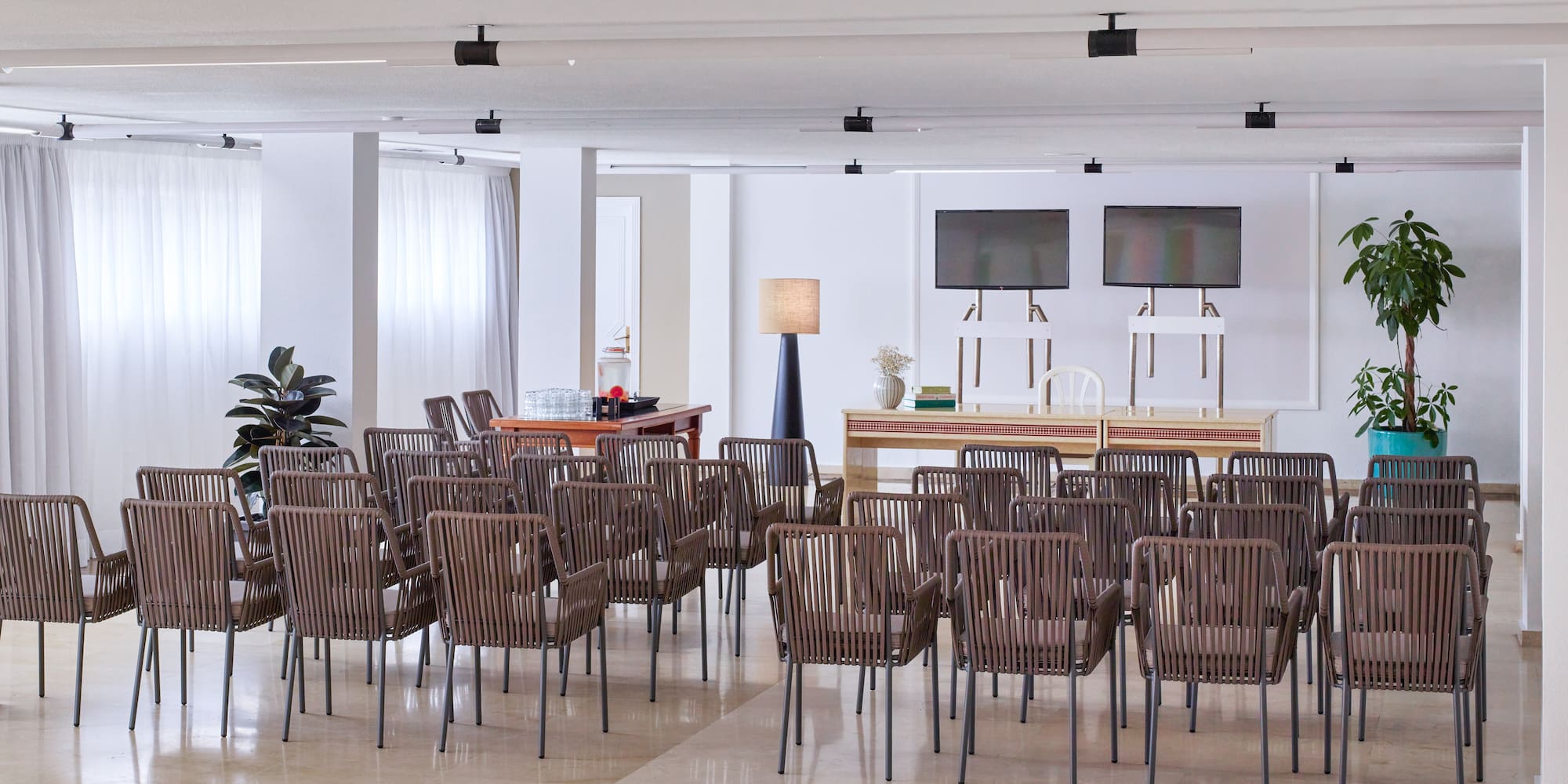 a room with many chairs and a table