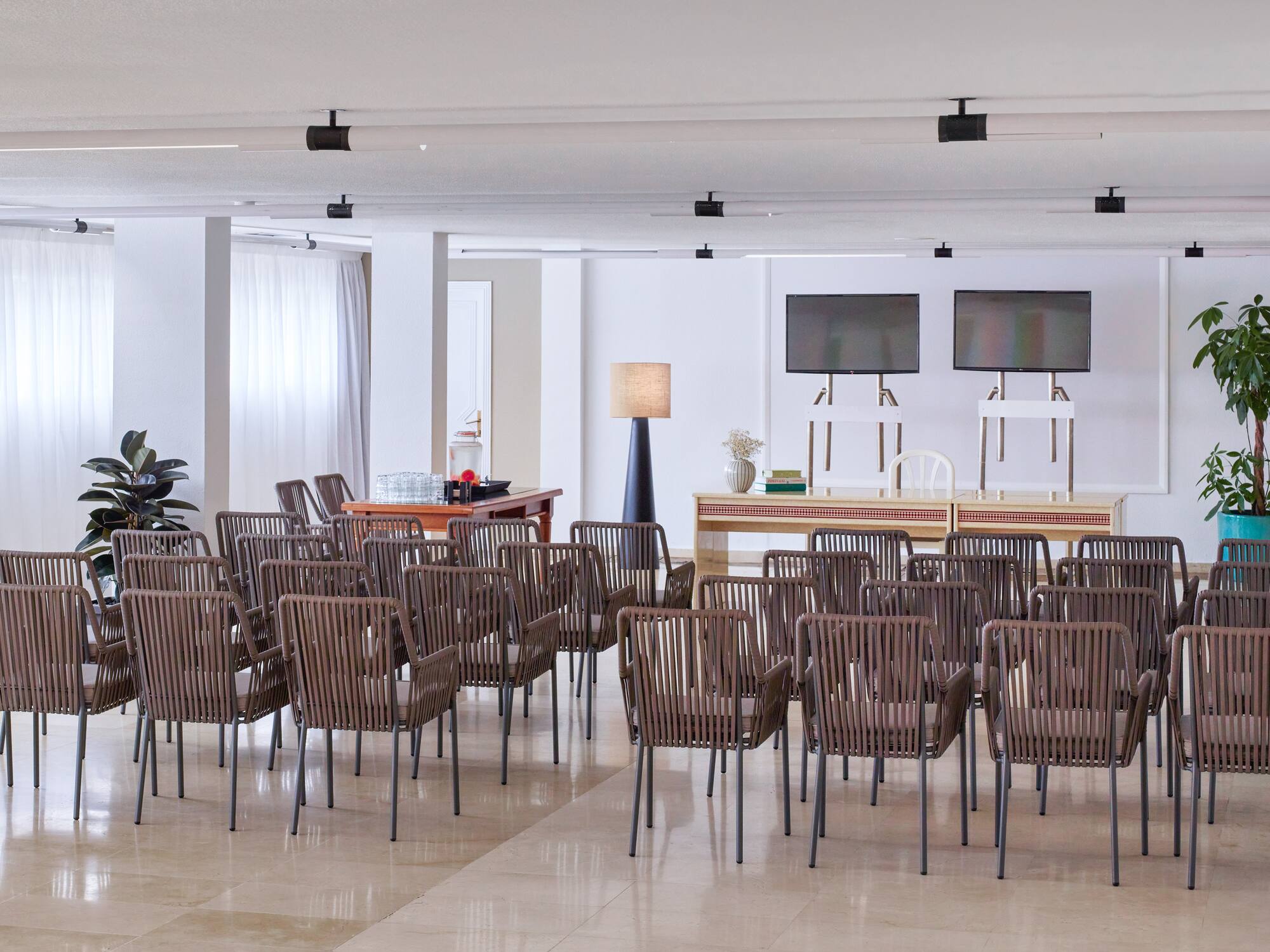 a room with many chairs and a table