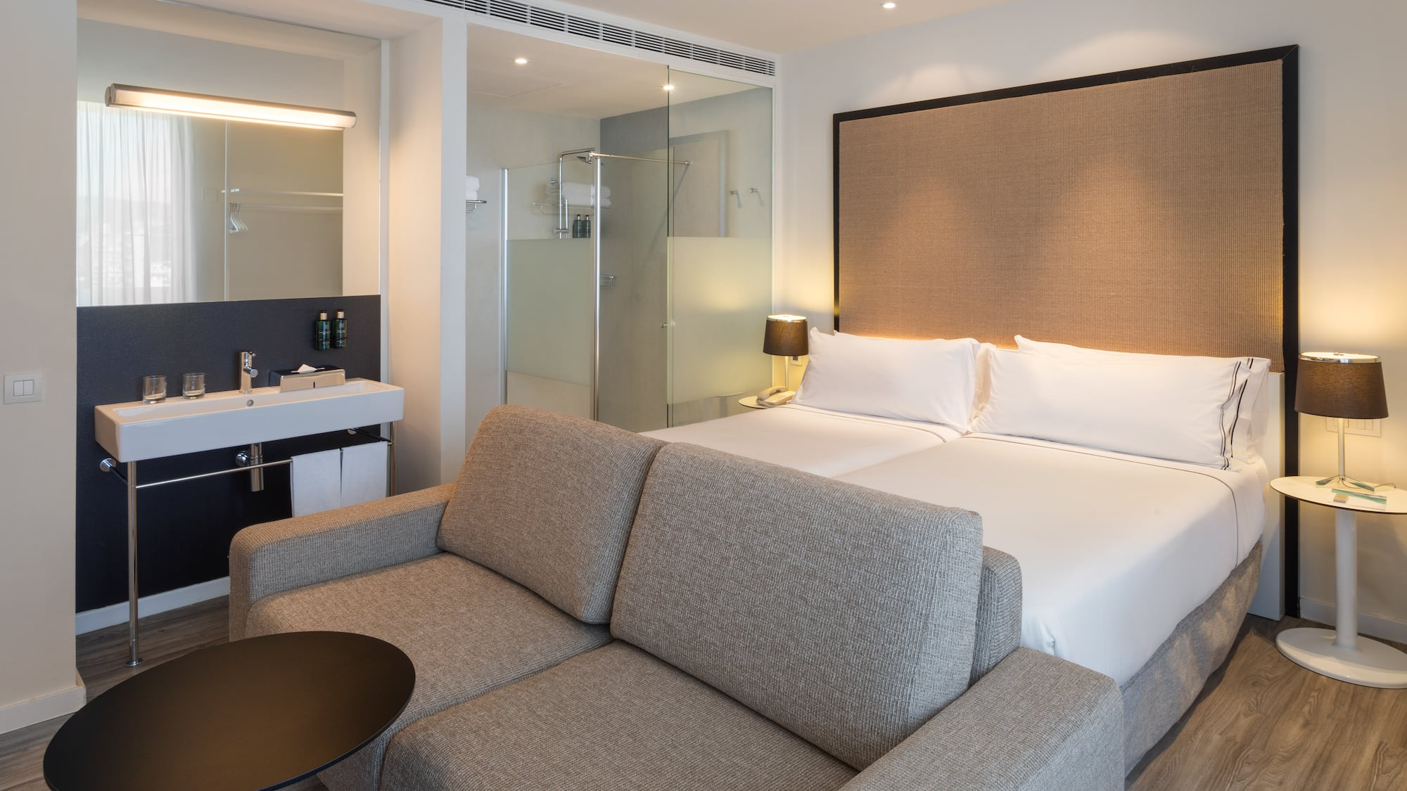 a hotel room with a bed and a shower