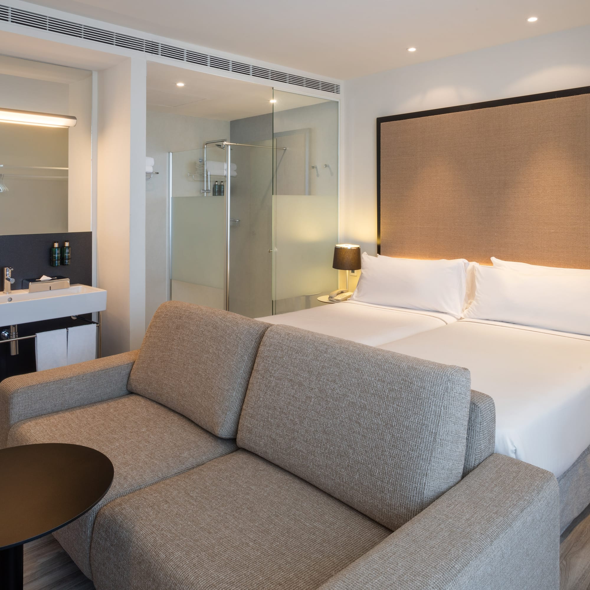 a hotel room with a bed and a shower