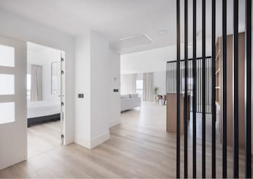 a room with a bed and a wood floor