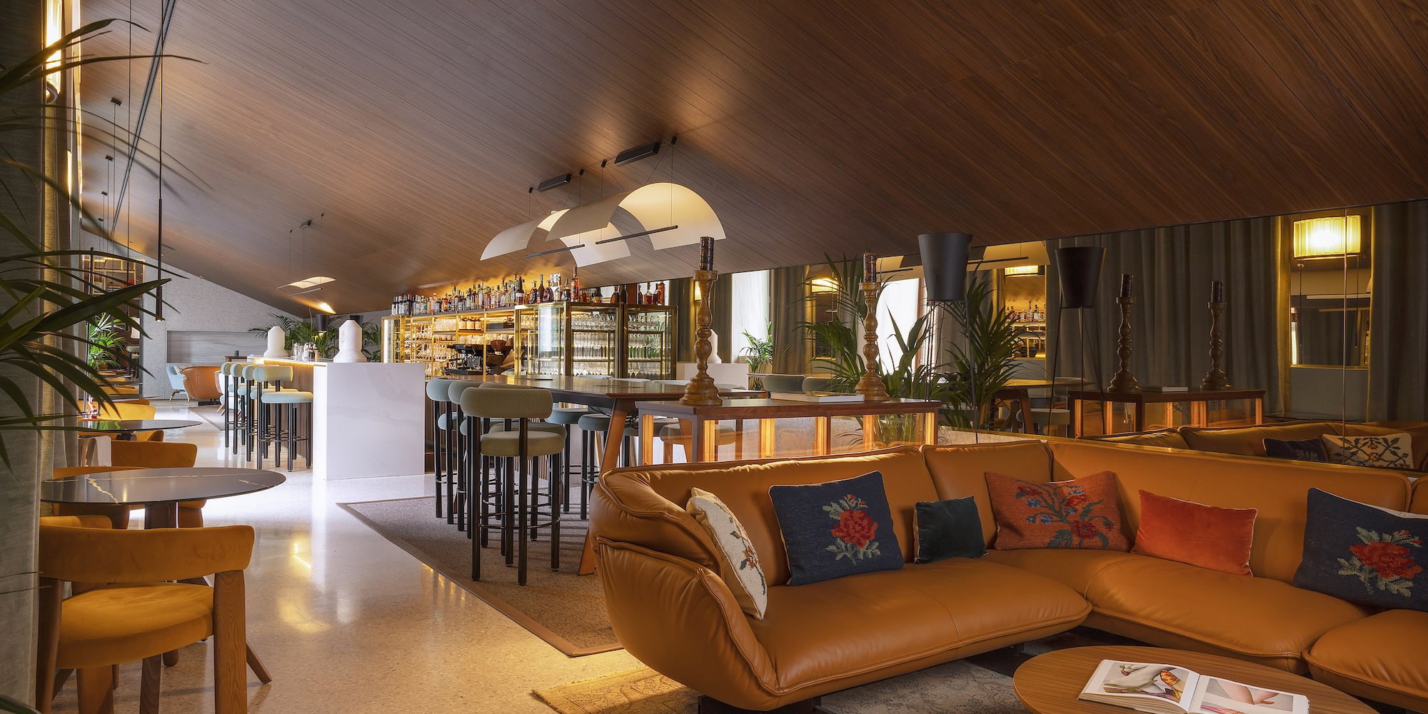 a room with a couch and a bar