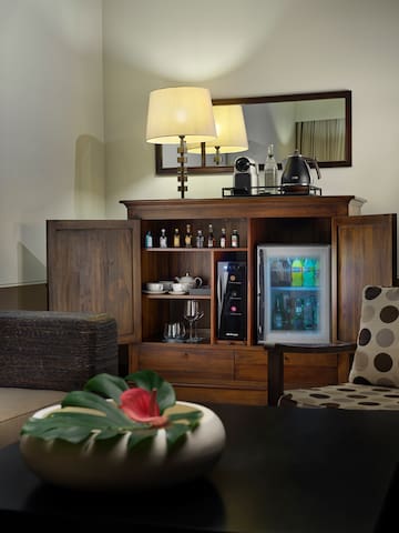 a room with a cabinet and a television