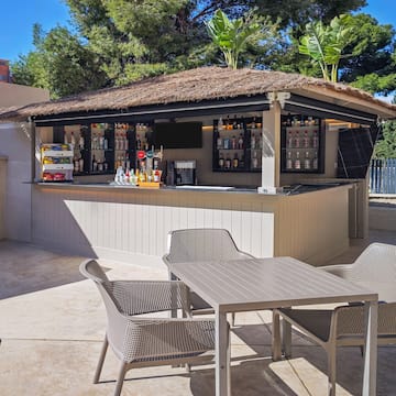 a bar with chairs and tables