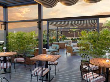 a patio with tables and chairs