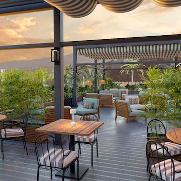 a patio with tables and chairs