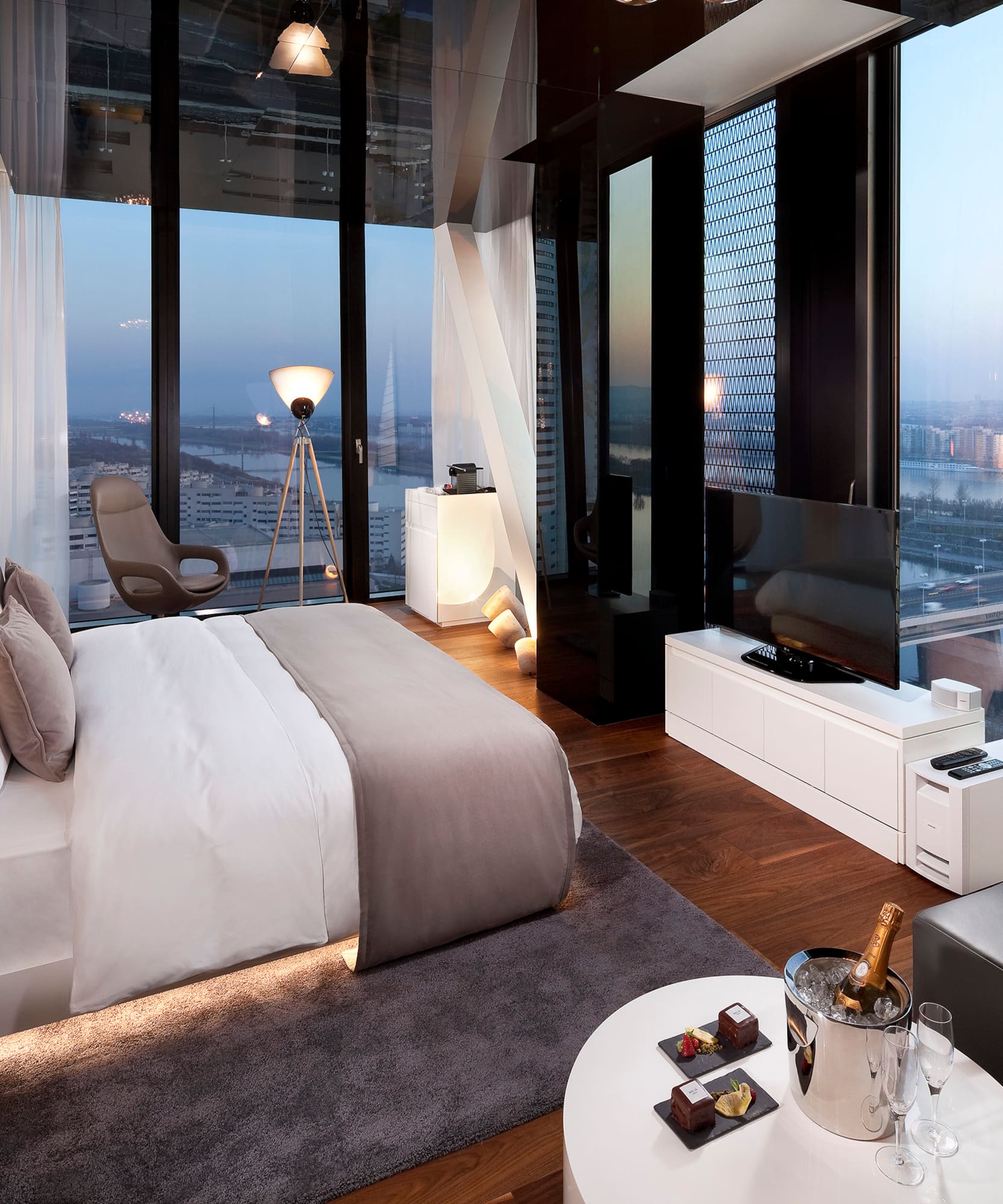 a bedroom with a large window