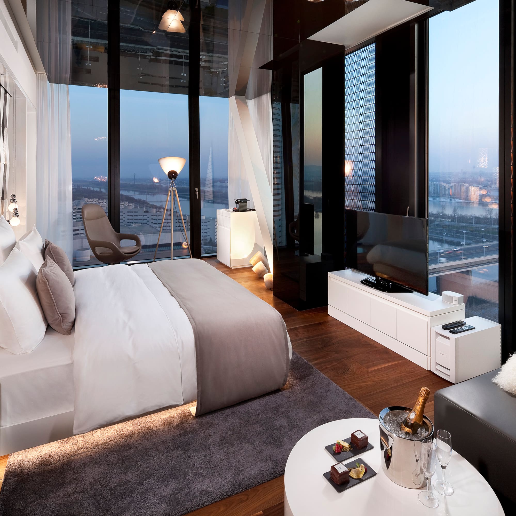 a bedroom with a large window