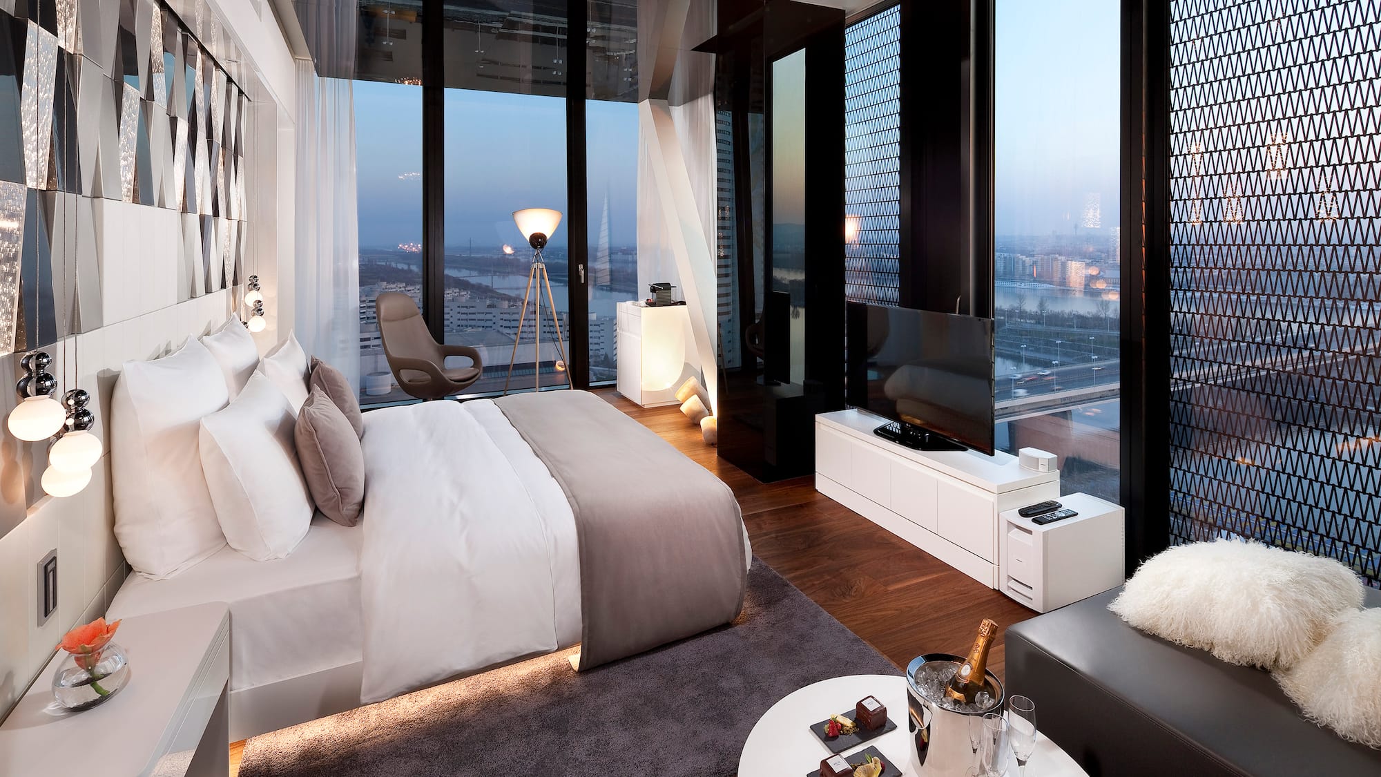 a bedroom with a large window