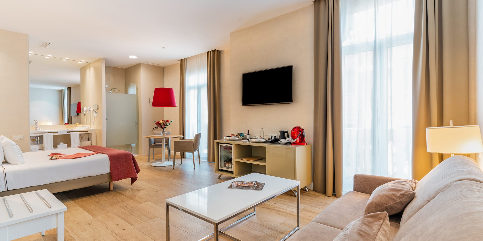 a room with a bed and a tv