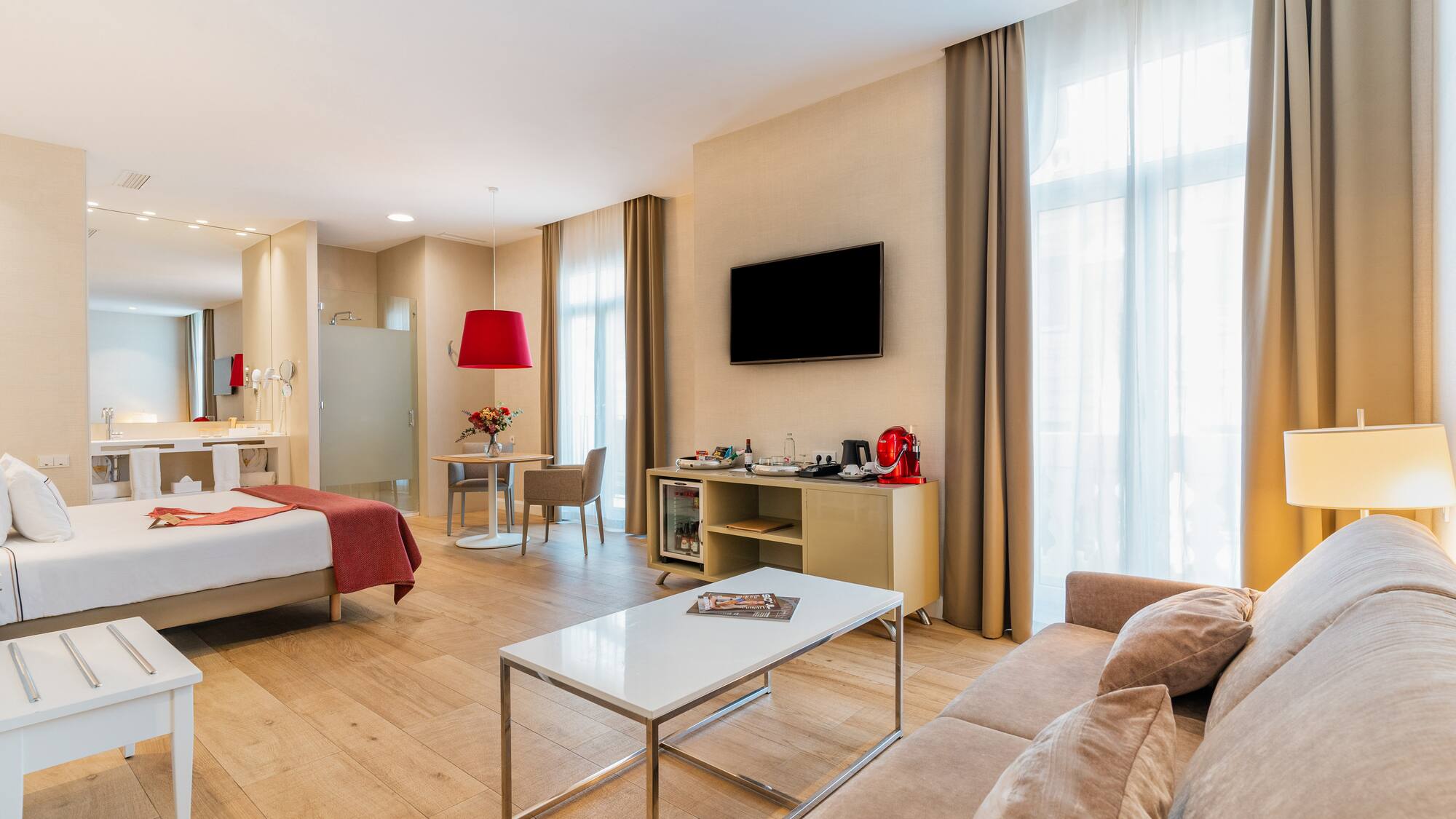 a room with a bed and a tv