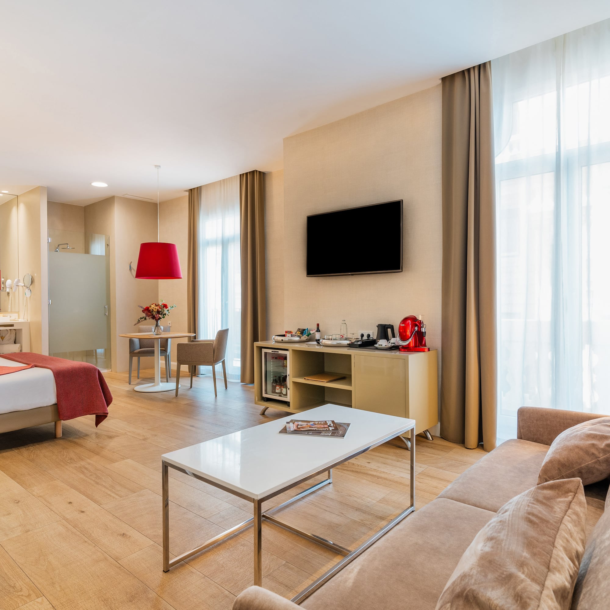 a room with a bed and a tv