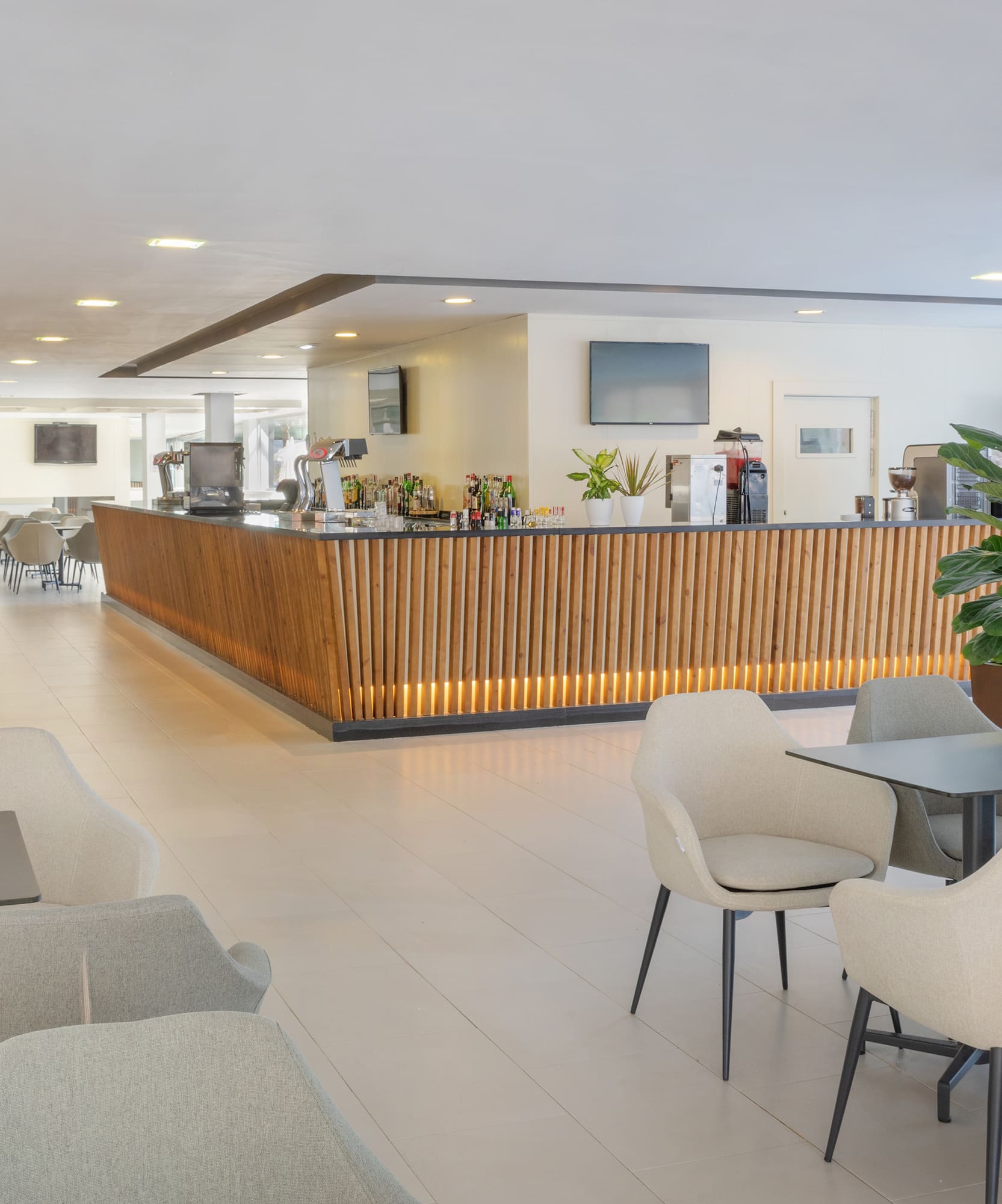 a room with a counter and chairs