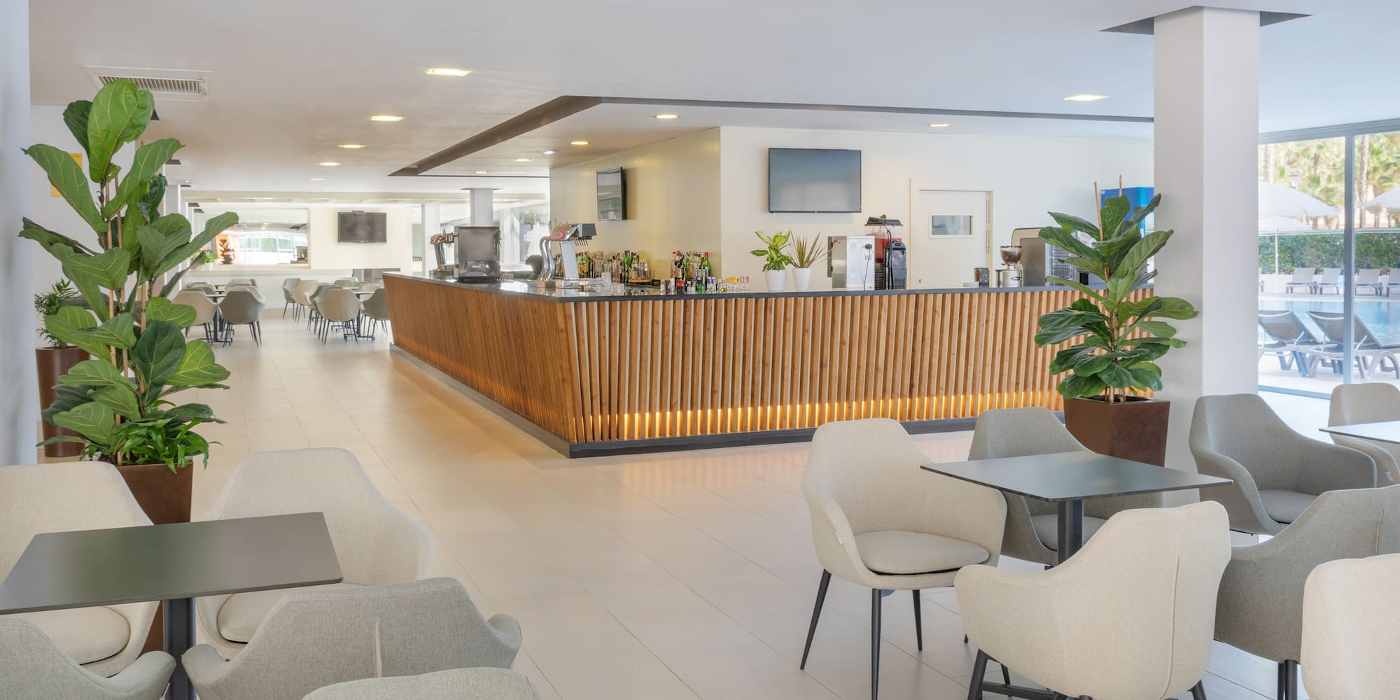 a room with a counter and chairs