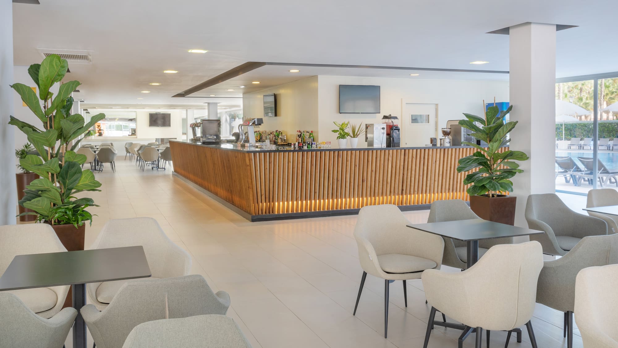 a room with a counter and chairs