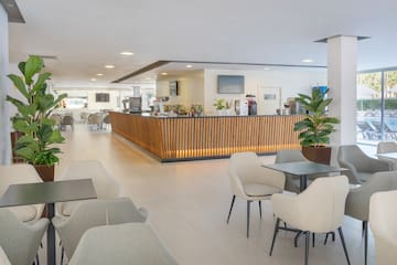 a room with a counter and chairs