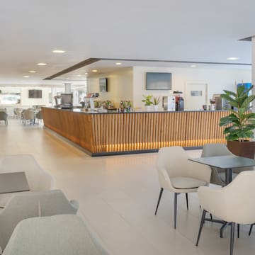 a room with a counter and chairs