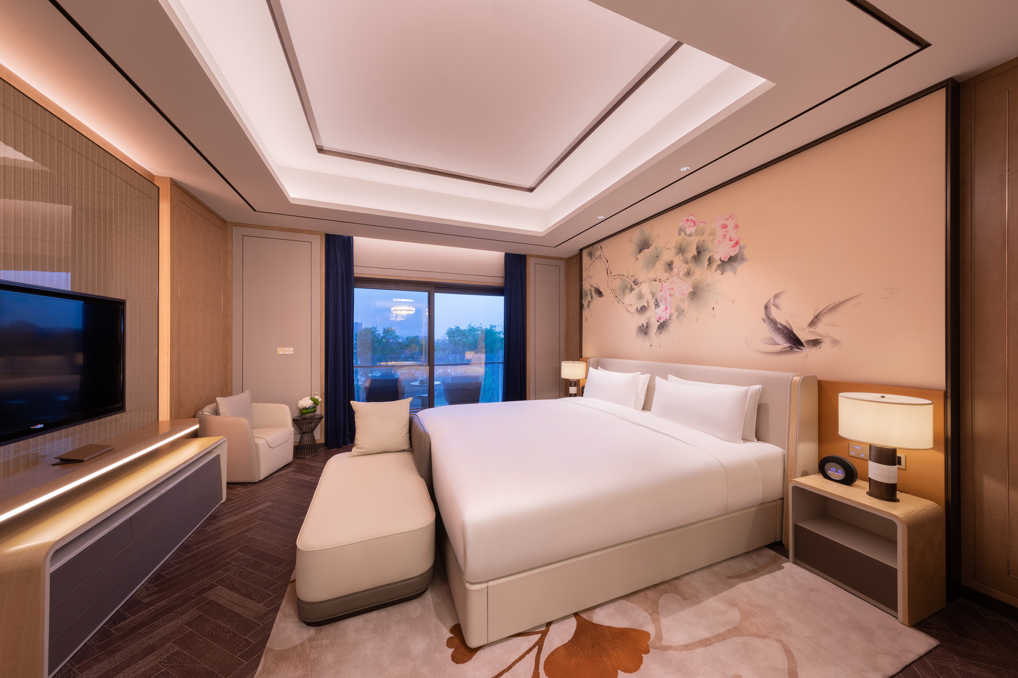 Modern hotel bedroom with king bed, Asian-inspired floral mural, and balcony.