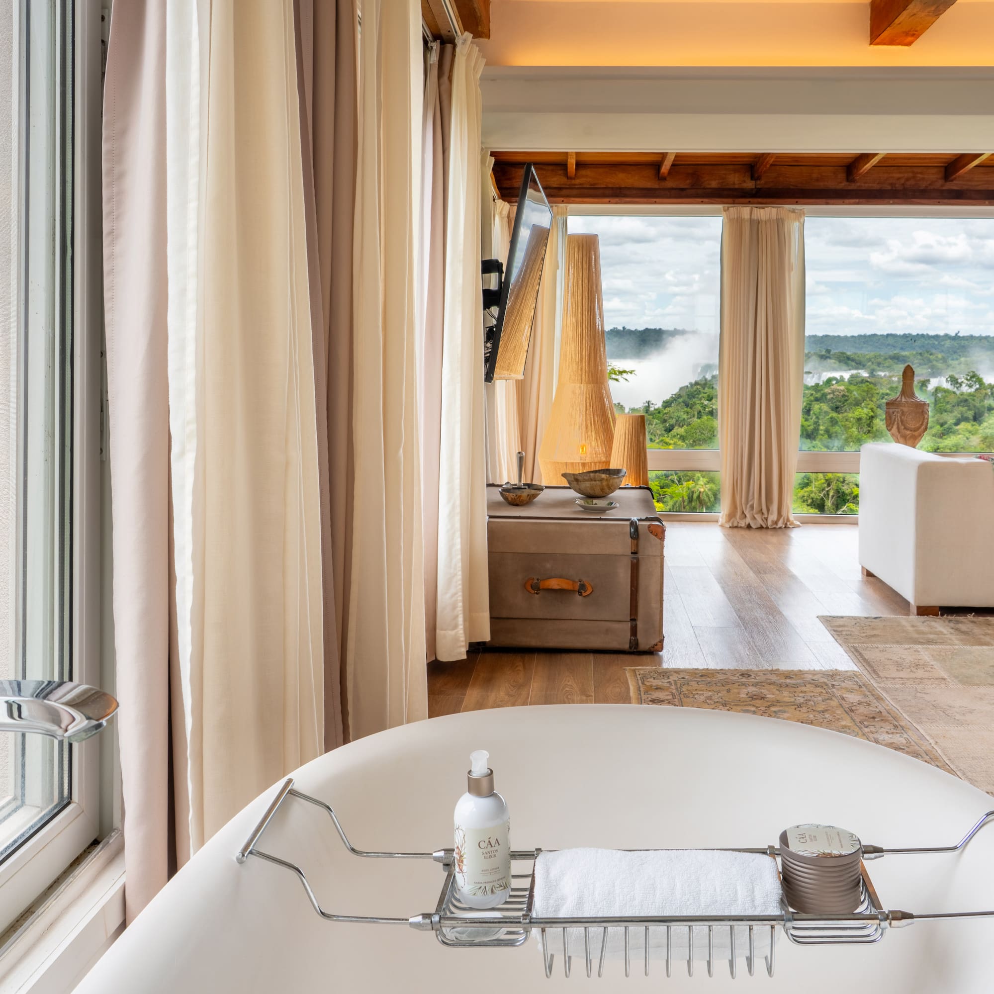 a bathroom with a tub and a large window