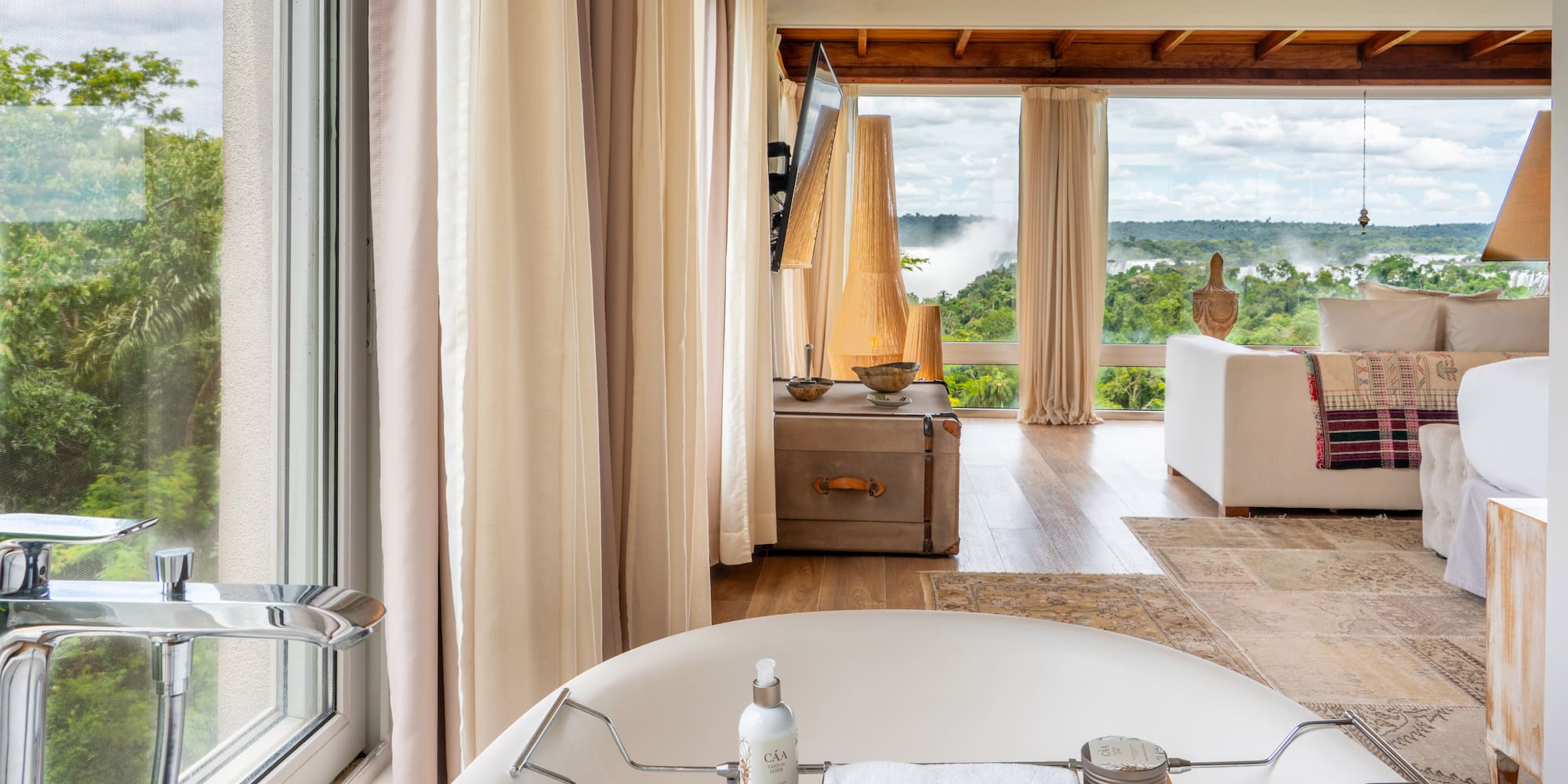 a bathroom with a tub and a large window