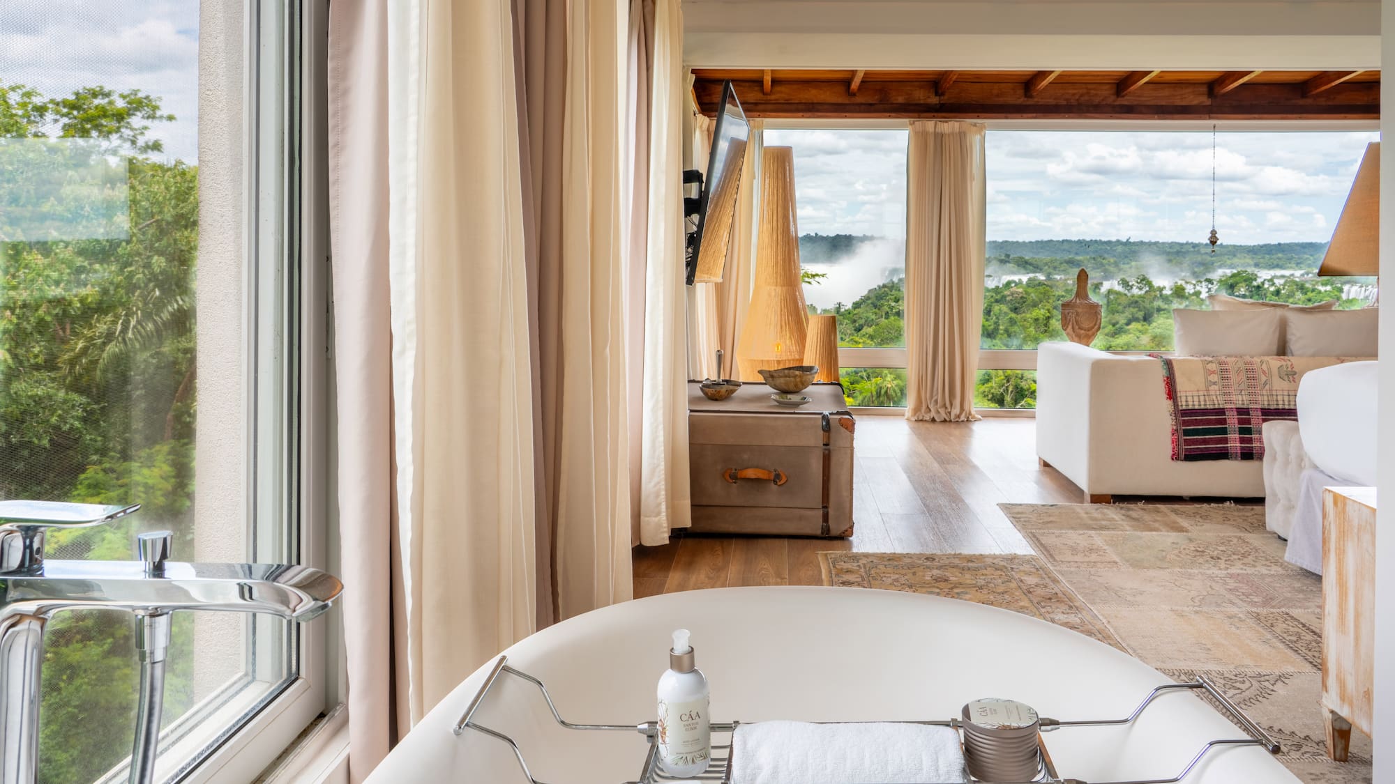 a bathroom with a tub and a large window