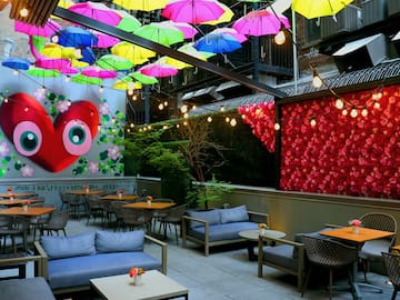a patio with colorful umbrellas