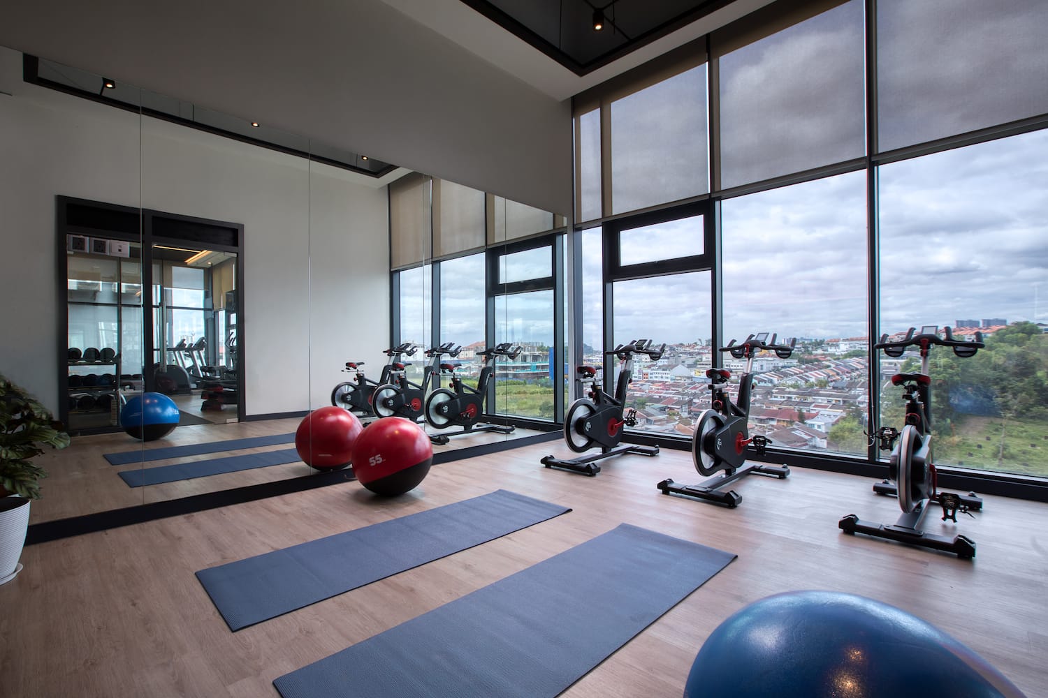 a room with exercise bikes and exercise balls
