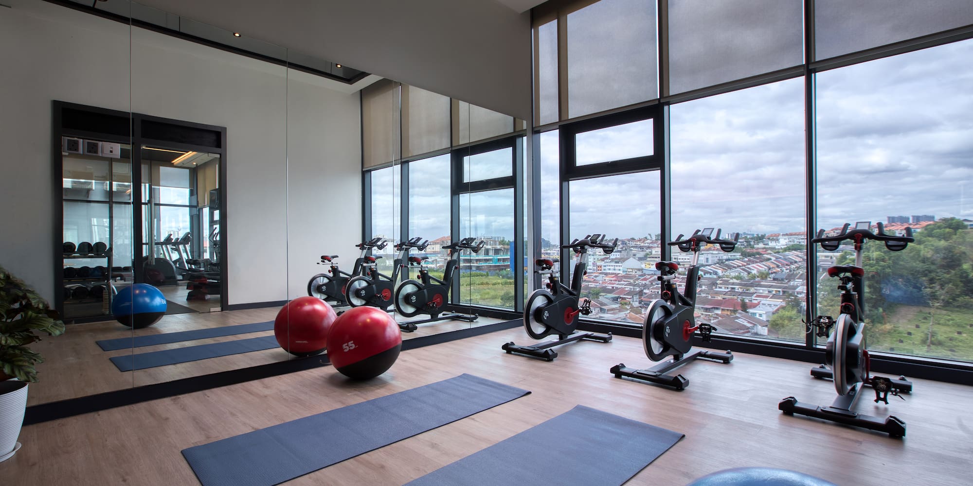 a room with exercise bikes and exercise balls
