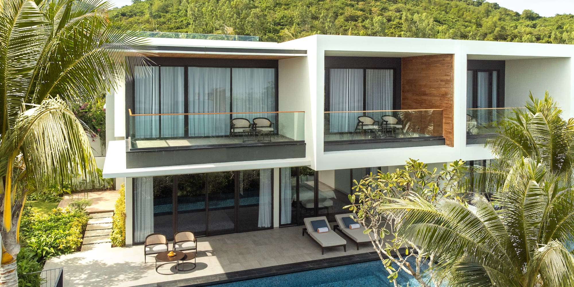 a house with a pool and trees