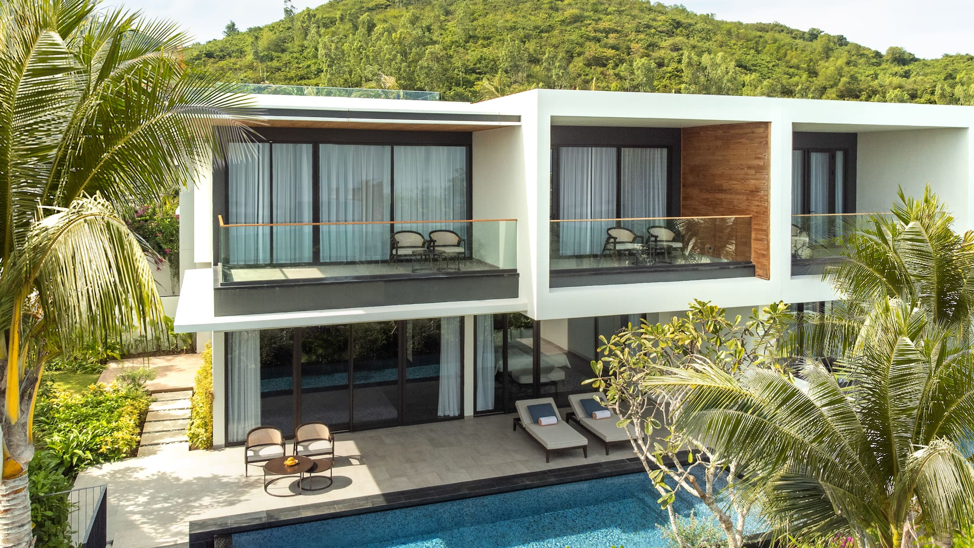 a house with a pool and trees