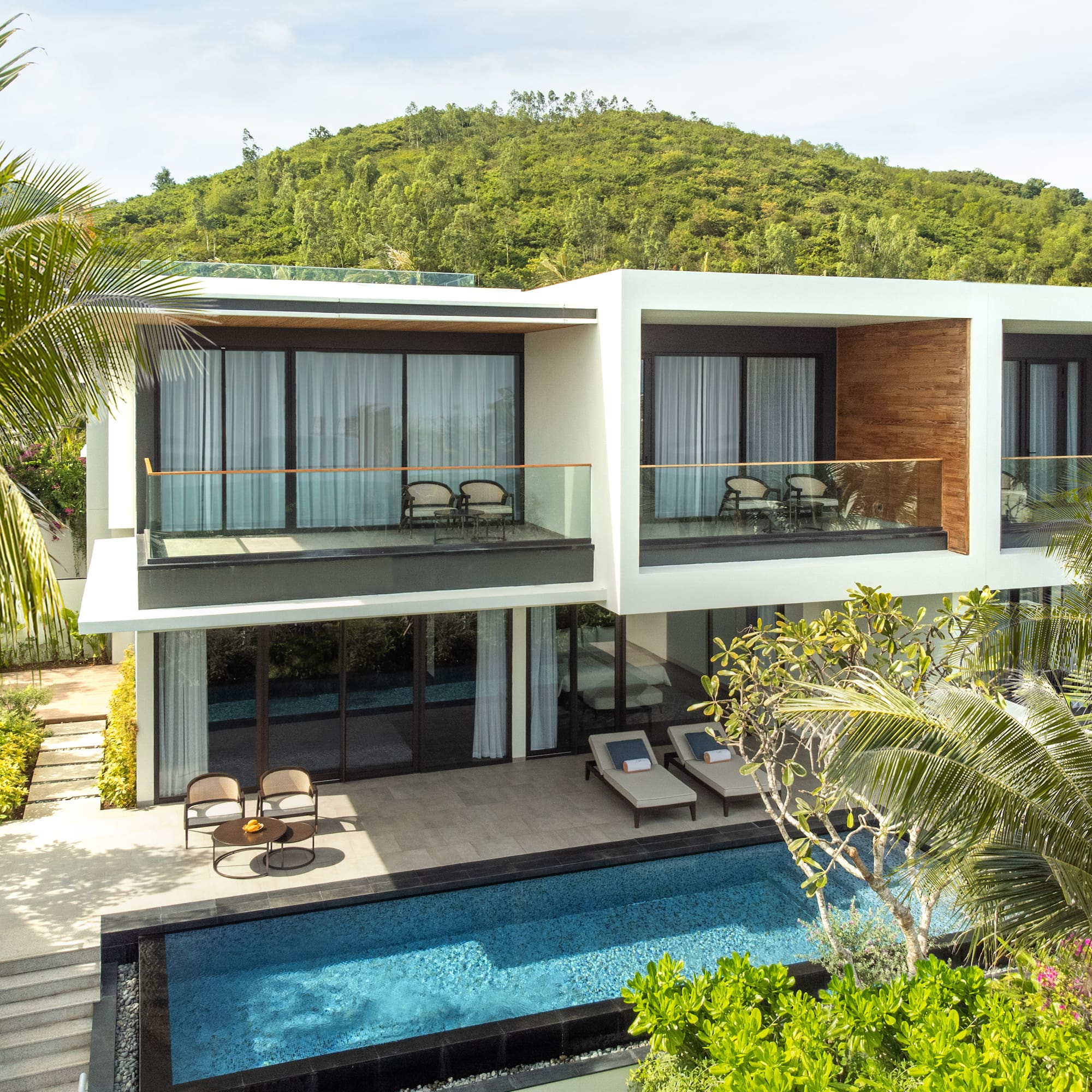 a house with a pool and trees