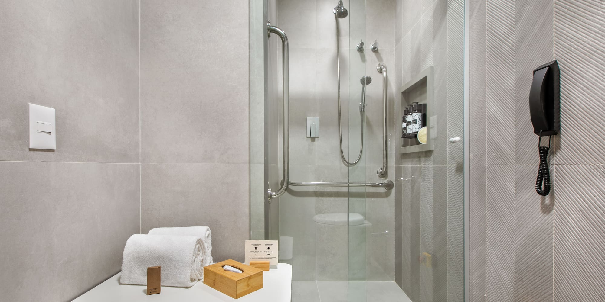 a bathroom with a glass shower door