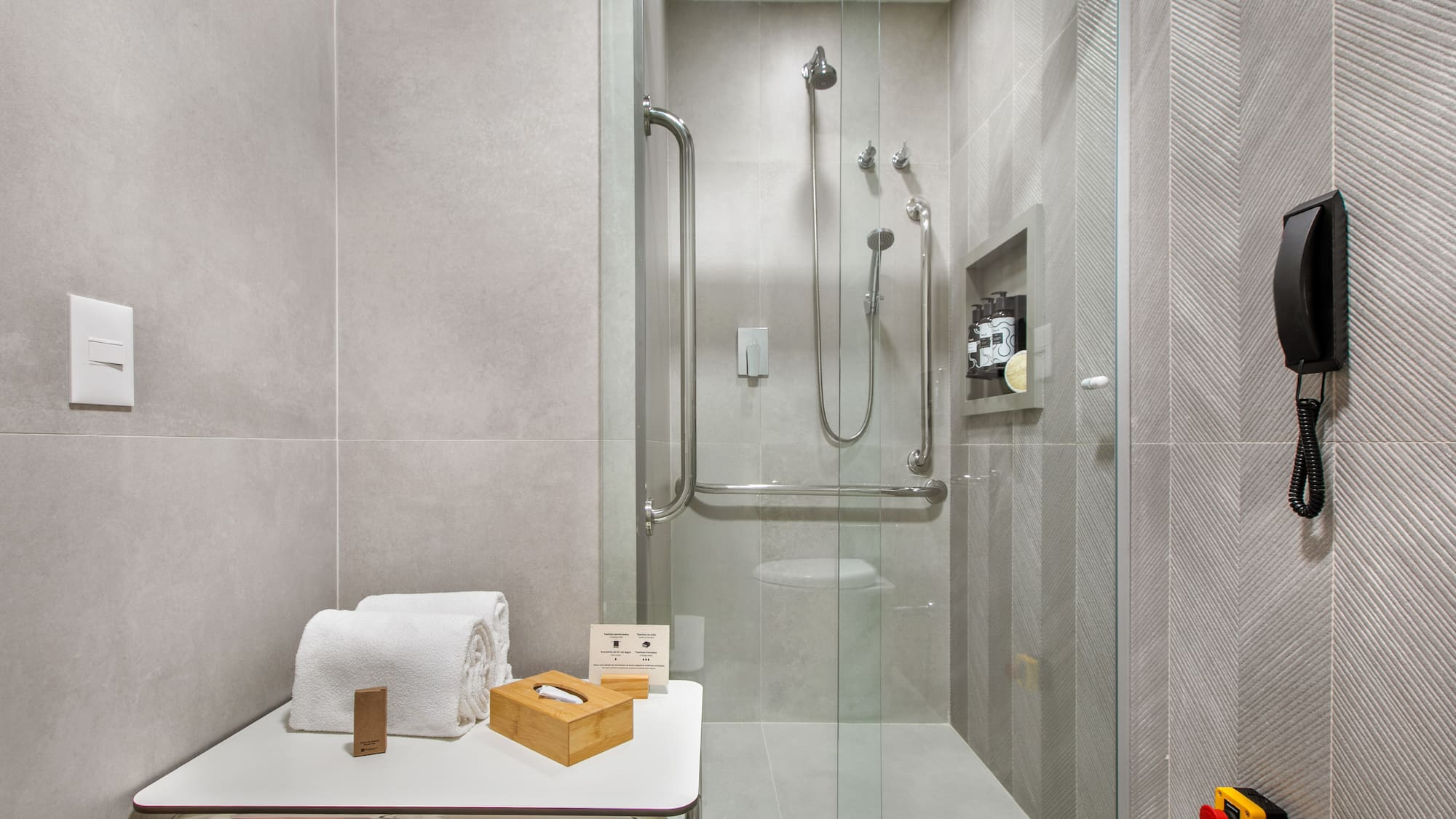 a bathroom with a glass shower door